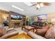 Spacious living room with stone accent wall, cozy leather seating, and large windows at 150 Hess Ave, Golden, CO 80401