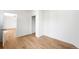 Bedroom featuring wood flooring and access to a closet at 215 E 11Th Ave # D5, Denver, CO 80203