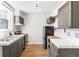 Functional kitchen with tile countertops, stainless steel appliances, and bright natural light at 215 E 11Th Ave # D5, Denver, CO 80203