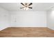 Bright and open living room with hardwood floors and an overhead ceiling fan at 215 E 11Th Ave # D5, Denver, CO 80203