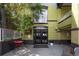 Charming restaurant exterior featuring outdoor seating, lush greenery, and inviting entryway at 215 E 11Th Ave # D5, Denver, CO 80203
