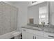 Stylish bathroom featuring a patterned shower curtain and granite-topped vanity for a luxurious feel at 20999 E Quincy Dr, Aurora, CO 80015