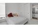 Cozy bedroom with plush carpet, a comfortable bed and convenient closet and bathroom access at 20999 E Quincy Dr, Aurora, CO 80015