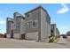 Modern townhouse exterior with gray siding, white trim, and attached garage at 20999 E Quincy Dr, Aurora, CO 80015