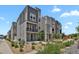 Modern homes with gray siding, stone accents, and well-kept landscaping at 20999 E Quincy Dr, Aurora, CO 80015