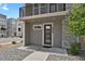 Front entry features a modern door, visible house number, and rock landscaping at 20999 E Quincy Dr, Aurora, CO 80015