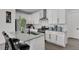 Bright, modern kitchen with granite counters, stainless appliances, and ample cabinets at 20999 E Quincy Dr, Aurora, CO 80015