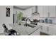 Bright kitchen with modern countertops, stainless appliances, and island seating at 20999 E Quincy Dr, Aurora, CO 80015