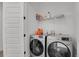 Efficient laundry area featuring modern washer and dryer units for convenient home care at 20999 E Quincy Dr, Aurora, CO 80015