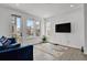 Bright living room with modern decor, large windows, and sleek flooring at 20999 E Quincy Dr, Aurora, CO 80015