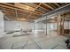 Unfinished basement showing the structural support for the building with white insulated walls at 23440 E Rockinghorse Pkwy, Aurora, CO 80016