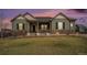 Charming single-Gathering home featuring a covered front porch and well-maintained lawn with lovely landscaping at 23440 E Rockinghorse Pkwy, Aurora, CO 80016