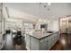Open-concept kitchen with an island flows seamlessly into the dining and living areas, great for entertaining at 23440 E Rockinghorse Pkwy, Aurora, CO 80016