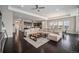 Bright and airy open floor plan seamlessly connects the living room, kitchen, and dining area at 23440 E Rockinghorse Pkwy, Aurora, CO 80016