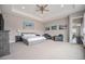 Large main bedroom with a king bed, seating area, and art, creating a relaxing retreat at 23440 E Rockinghorse Pkwy, Aurora, CO 80016