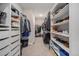 Spacious walk-in closet with custom shelving, offering ample storage for clothing and accessories at 23440 E Rockinghorse Pkwy, Aurora, CO 80016