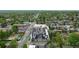 Aerial view of a modern, multi-unit residence nestled in a vibrant neighborhood with mature trees and community park at 5125 W 29Th Ave # 1, Denver, CO 80212