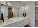 Modern bathroom with a double vanity, sleek countertops, and a large mirror with contemporary lighting at 5125 W 29Th Ave # 1, Denver, CO 80212