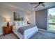 Inviting bedroom with neutral decor, ample natural light, and a comfortable bed with stylish bedding at 5125 W 29Th Ave # 1, Denver, CO 80212