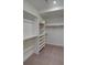 Spacious walk-in closet featuring built-in shelving and ample storage space for an organized wardrobe at 5125 W 29Th Ave # 1, Denver, CO 80212