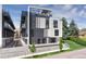 Modern multi-story building with a rooftop deck, black and white facade at 5125 W 29Th Ave # 1, Denver, CO 80212