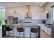 Modern kitchen featuring a large island, stainless steel appliances, and sleek white cabinetry at 5125 W 29Th Ave # 1, Denver, CO 80212