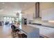 Modern eat-in kitchen with stainless steel appliances and marble countertops at 5125 W 29Th Ave # 1, Denver, CO 80212
