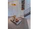 Close up of kitchen island with a vase of flowers and staircase in the background at 5125 W 29Th Ave # 1, Denver, CO 80212