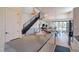 Open floorplan with marble kitchen island, pendant lighting, and lots of natural light at 5125 W 29Th Ave # 1, Denver, CO 80212