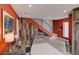 Spacious living area showcases desk, workout space and unique accent wall with under stair storage at 5125 W 29Th Ave # 1, Denver, CO 80212