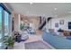 Living space showcasing the open floor plan, modern staircase, contemporary kitchen, and lots of light at 5125 W 29Th Ave # 1, Denver, CO 80212