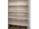 A pantry closet has multiple shelves and wood floors at 5125 W 29Th Ave # 1, Denver, CO 80212