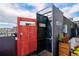 Private rooftop deck features an outdoor shower, dining area, and lounge furniture at 5125 W 29Th Ave # 1, Denver, CO 80212