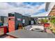 Entertainer's rooftop deck equipped with a full kitchen, seating area, and hot tub for luxurious outdoor living at 5125 W 29Th Ave # 1, Denver, CO 80212
