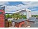 Outdoor rooftop living area features a built-in kitchen, fire pit, and hot tub for ultimate relaxation at 5125 W 29Th Ave # 1, Denver, CO 80212
