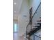 Modern staircase with wood treads, metal railings, and high ceilings at 5125 W 29Th Ave # 1, Denver, CO 80212