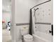 Tiled bathroom featuring a tub and shower combo next to a bedroom at 937 Aztec Dr, Castle Rock, CO 80108