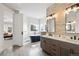 Bright bathroom with a soaking tub, double vanity, and stylish fixtures at 937 Aztec Dr, Castle Rock, CO 80108