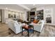 Spacious living room with a fireplace and bar area, perfect for entertaining at 937 Aztec Dr, Castle Rock, CO 80108