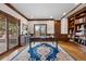 Spacious office with custom wood trim, hardwood floors, and built in bookshelves at 937 Aztec Dr, Castle Rock, CO 80108