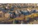 Community aerial view showing a well-planned neighborhood with mature trees at 17724 E Oakwood Pl, Aurora, CO 80016