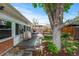 Beautiful backyard with deck, mature trees, and manicured lawn at 40 Colorado Blvd, Denver, CO 80206