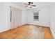 Bedroom featuring hardwood floors and translucent pink curtains at 40 Colorado Blvd, Denver, CO 80206