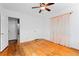 Light-filled bedroom with white walls, hardwood floors, and walk in closet at 40 Colorado Blvd, Denver, CO 80206