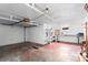 Spacious garage with overhead door, storage shelves, and work bench area at 40 Colorado Blvd, Denver, CO 80206