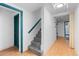 Hallway with staircase, carpet, and contrasting door and trim paint at 40 Colorado Blvd, Denver, CO 80206