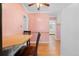 Open kitchen with light pink walls and a wood countertop at 40 Colorado Blvd, Denver, CO 80206