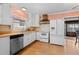 Traditional kitchen with white cabinetry, wood countertops and stainless steel appliances at 40 Colorado Blvd, Denver, CO 80206