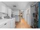 Spacious laundry room with modern appliances and storage, with wood floors at 40 Colorado Blvd, Denver, CO 80206