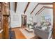 Spacious living room with hardwood floors, a high vaulted ceiling, and large windows for natural light at 40 Colorado Blvd, Denver, CO 80206